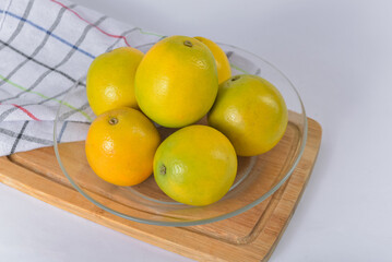 Fresh Brazilian oranges on a clean, minimalist table