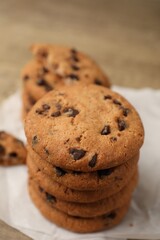 Delicious chocolate chip cookies on table, closeup