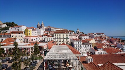 Rooftop view of a European city with colorful buildings and a church