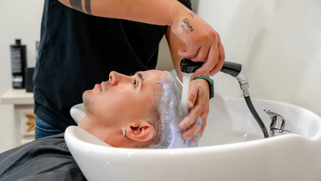 Professional hair bleaching service at barbershop