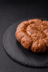 Grilled sausage in the shape of a spiral or snail, from chicken or pork. Spiral or snail sausage
