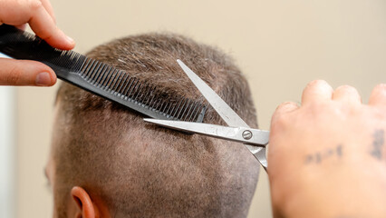 Precision haircut technique in a barbershop setting