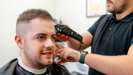 Customer receiving haircut at a professional barbershop