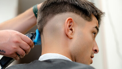 Precision haircut in a modern barbershop setting