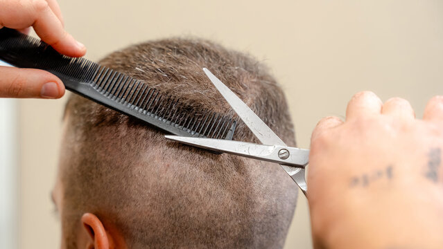Precision haircut technique in a barbershop setting