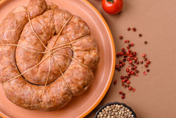 Grilled sausage in the shape of a spiral or snail, from chicken or pork. Spiral or snail sausage