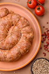 Grilled sausage in the shape of a spiral or snail, from chicken or pork. Spiral or snail sausage