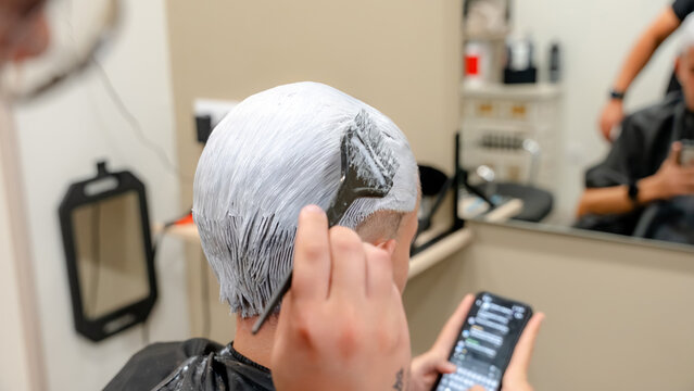 Hair bleaching process in modern barbershop setting