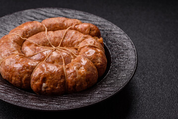 Grilled sausage in the shape of a spiral or snail, from chicken or pork. Spiral or snail sausage