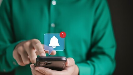 Person using smartphone with notification bell icon and red alert badge