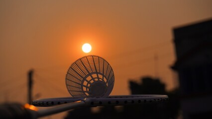 badminton racket golden sunset 