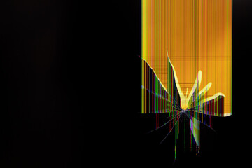 Cracked electronic screen displaying vibrant distorted pixel lines and abstract yellow light, symbolizing serious technological malfunction, data corruption, or system failure