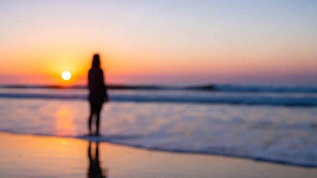 Solitary Figure Blurred Against A Serene Sunset Over The Ocean