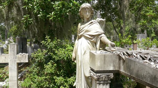 Bonaventure Cemetery in Savannah, Georgia. The Taliaferro family memorial with Angel and Cross statues. Smooth motion camera.