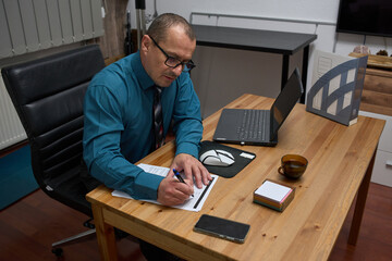 Businessman signing a document