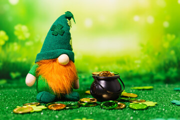 St. Patrick's plush next to a cauldron with coins