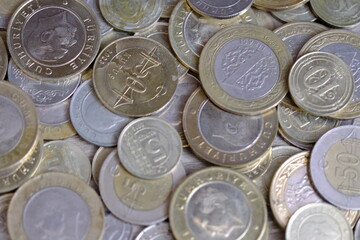A close-up view of Turkish lira coins in bulk. 5 lira, 50 kuruş, 1 TL, 5 kuruş, 10 kuruş. Economic crisis. Inflation. Salary increases for retirees and civil servants. Turkish Lira money.