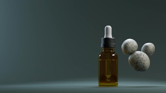 Cosmetic serum bottle next to stones.