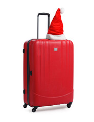 Santa hat on red suitcase against white background. Christmas vacation