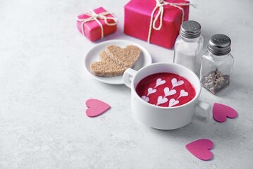 Beet soup puree with cream in the form of hearts for Valentine's day holidays