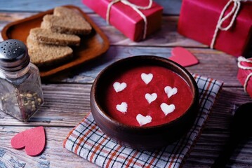 Beet soup puree with cream in the form of hearts for Valentine's day holidays
