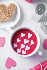 Beet soup puree with cream in the form of hearts for Valentine's day holidays