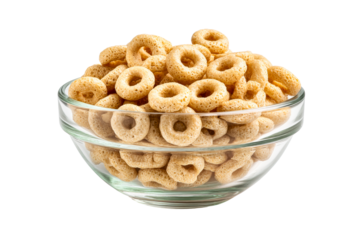 Crunchy oat cereal rings overflowing in a clear glass bowl, a healthy wholegrain breakfast food with a porous texture, captured in a detailed studio shot