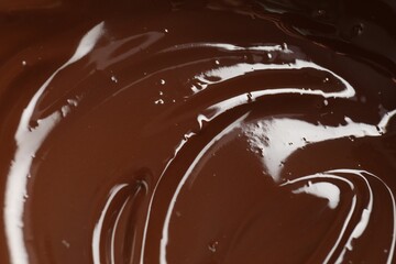 Tasty melted chocolate as background, closeup view