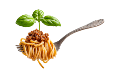 Spaghetti bolognese topped with fresh basil on fork