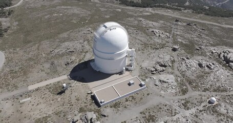 Aerial drone shot of Calar Alto Observatory telescopes in the Sierra de Los Filabres mountain range in Almeria, Andalusia, Spain. Largest astronomical observatory in Europe. Top-down view