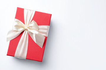 Beautiful gift on white background, top view. Space for text