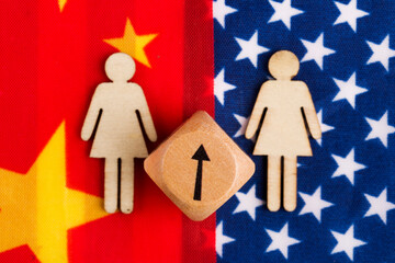 the flag of the Chinese and the USA and the little man with the cube of the sign is to be raised. Concepts of tariff growth of two countries