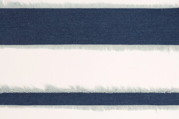 Grunge blue canvas denim fabric torn lines strip rectangle frame. Texture abstract background.