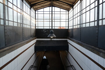 alone woman in a railway station interior