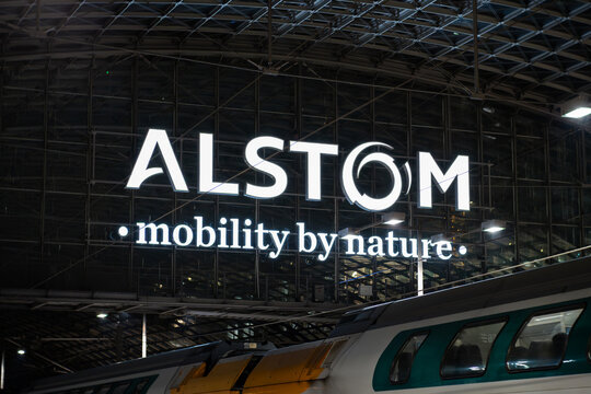 BERLIN, GERMANY - 26. November 2025: Alstom logo illuminated in the central station building. Close-up of the rail transportation company sign with the slogan "mobility by nature".