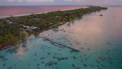 Luxury resort photo of French Polynesia tropical 
paradise islands Fakarava with coral reef. 
Aerial perspective photography with azure ocean, 
sky with clouds on horizon. Pacific Ocean.