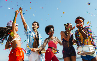 Brazilian carnival party on the beach with confetti