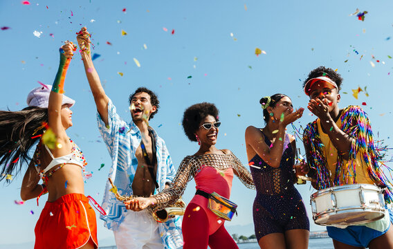 Brazilian carnival party on the beach with confetti