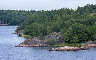Stone cliffs of Scandinavia. Shores of the islands of the Stockholm archipelago, Sweden.