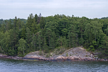 Stone cliffs of Scandinavia. Shores of the islands of the Stockholm archipelago, Sweden.