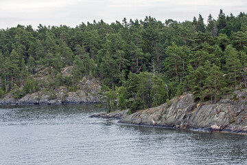 Stone cliffs of Scandinavia. Shores of the islands of the Stockholm archipelago, Sweden.