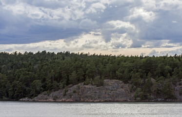 Stone cliffs of Scandinavia. Shores of the islands of the Stockholm archipelago, Sweden.