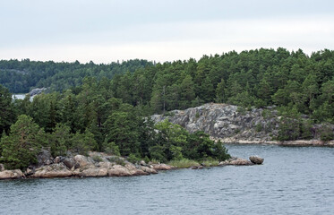 Stone cliffs of Scandinavia. Shores of the islands of the Stockholm archipelago, Sweden.