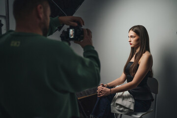 Arts Photography Session, Casual Studio Portrait Capturing Model With Gentle Shadows And Focused Expression