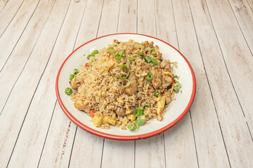 Creole-style fried rice with shredded roast pork, crispy bacon, a thin, chopped omelet, and plenty of scallions, garnished with toasted sesame seeds