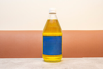 A half-liter glass bottle containing yellow soda