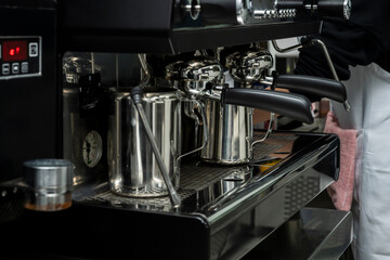 A pressure machine for preparing coffee and hot drinks in a bar