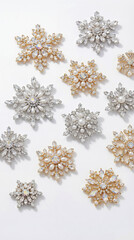 Elegant crystal snowflake brooches with rhinestones, diamonds and pearls on white background. Luxury winter jewelry collection with sparkling gems and iridescent stones. Holiday fashion accessories.