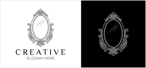 Ornate oval mirror logo design with decorative frame presented on both white and black backgrounds. © fafa
