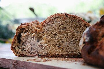 Close-up Macro Shot of Sliced Artisanal Sourdough Bread Loaf, Highlighting the Open Crumb and Rustic Interior Texture